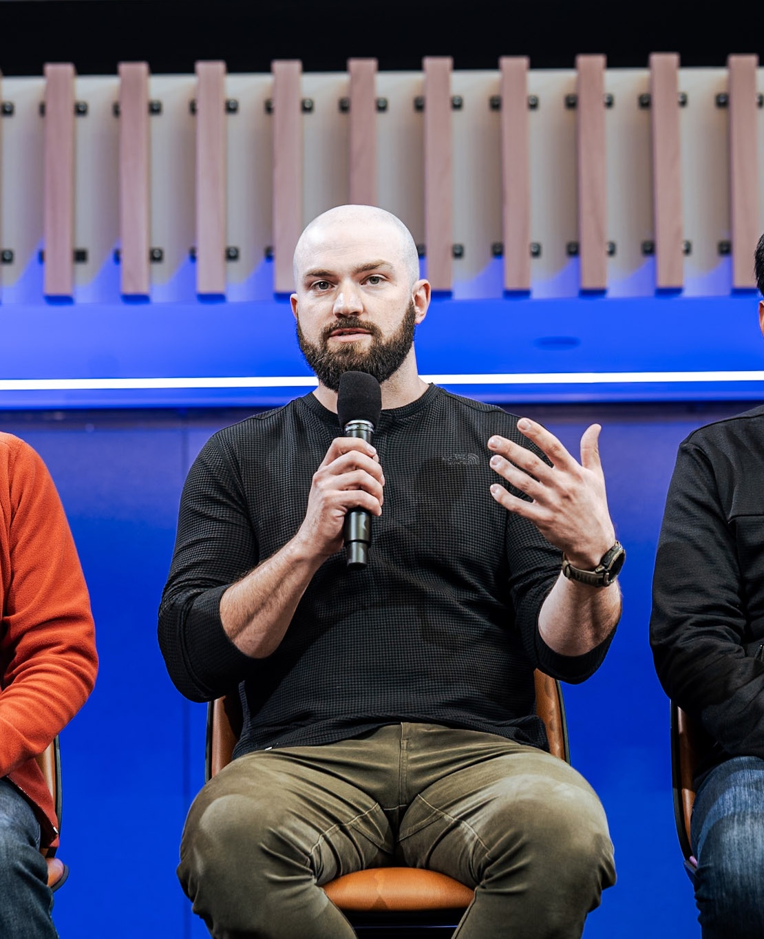 Matt Rae speaking on stage at an Adobe event